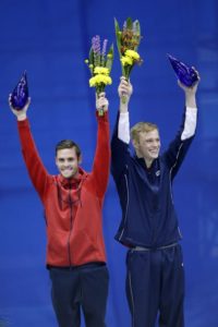 David Boudia, left, and Steele Johnson wave to the crowd after being named to the U.S. Olympic diving team in the men's 10-meter platform at the U.S. Olympic diving trials Sunday, June 26, 2016, in Indianapolis. (AP Photo/AJ Mast)